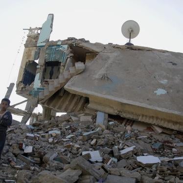 A boy stands on the debris of a building destroyed by the Egyptian army on the Egyptian side of the town of Rafah, Egypt, on November 6, 2014, near the start  of the conflict in northern Sinai. 