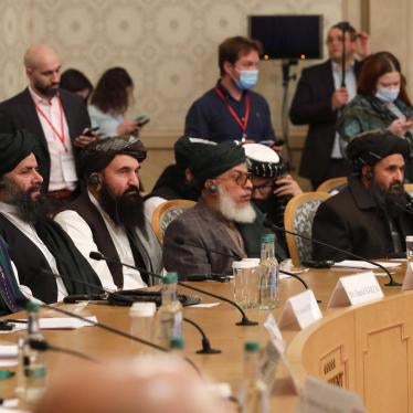 Former President Hamid Karzai, left, and Taliban co-founder Mullah Abdul Ghani Baradar, second right, attend an international peace conference in Moscow, Russia, March 18, 2021. 