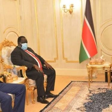 Former National Security Service official Akol Koor Kuc [left] is pictured with President Salva Kiir (R)