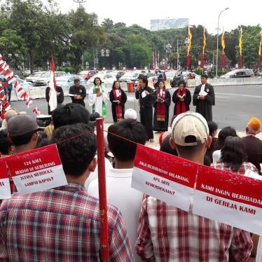 Indonesia's religious minorities, including Christians, Ahmadis, Buddhists and native faith believers, celebrate Indonesia’s Independence Day outside the State Palace in Jakarta