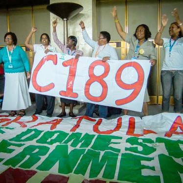 Domestic worker leaders chant “Up up domestic workers, down down with slavery” after the ILO vote to adopt the Domestic Workers Convention, June 16, 2011