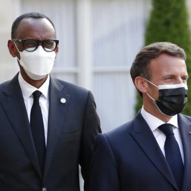 French President Emmanuel Macron, right, welcomes Rwanda President Paul Kagame at a dinner for leaders of African states, at the Elysee Palace, Paris, May 17, 2021.
