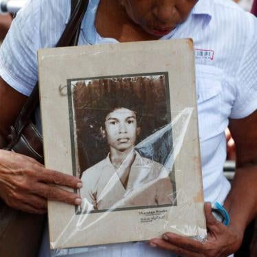 A Sri Lankan woman holds a portrait of a relative who went missing, during a protest in Colombo, Sri Lanka,  February 14, 2020.