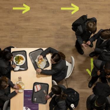 Students eat lunch at Chertsey High School on March 09, 2021 in Chertsey, United Kingdom. 