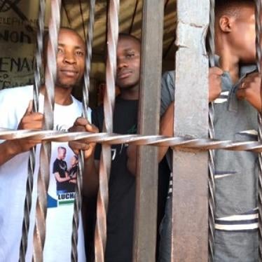 Youth activists Eric Muhindo, left, and Elisée Lwatumba, center, at Butembo’s central prison, eastern Democratic Republic of Congo.