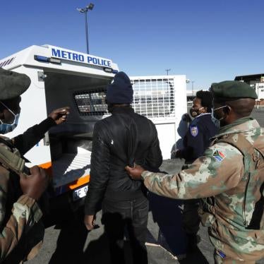 A man suspected of looting is arrested at a shopping mall in Soweto, near Johannesburg, Tuesday July 13, 2021. 