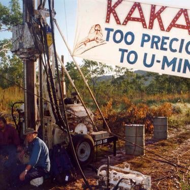 Two Jabiluka mine protesters sit chained to heavy drilling equipment installed at the proposed site of the Jabiluka Uranium mine in Jabiluka, Australia on March 24, 1998.