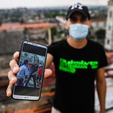Cuban Rolando Remedios shows a photo of him being arrested during the July 11 protests on his mobile phone at his home in Havana, Cuba, on August 7, 2021.