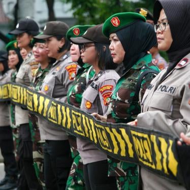 Female national army officers and police officers escort hundreds of women who packed the area in front of the State Palace in Jakarta, Indonesia on March 8, 2020, in commemoration of International Women's Day.