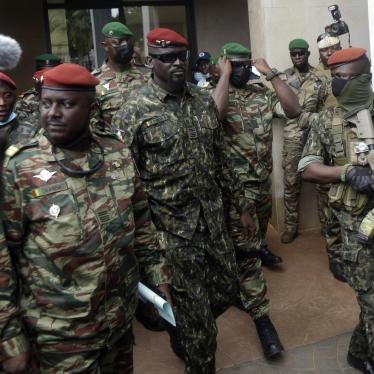 Guinea's Col. Mamady Doumbouya, center, is heavily guarded by soldiers after a meeting with ECOWAS delegation in Conakry, Guinea on September 10, 2021.