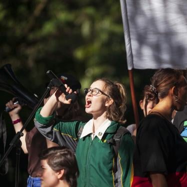 A student protester speaks to the crowd during a climate change protest in Brisbane.