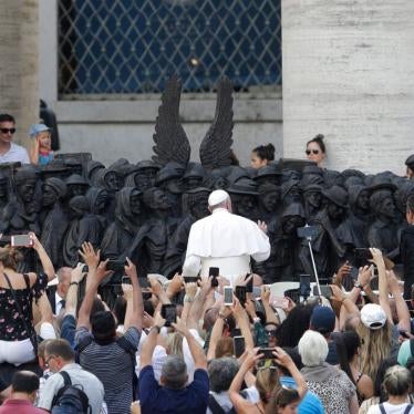 Pope Francis unveils the sculpture on the theme of refugees and migration ' Angels Unawares ' by Canadian sculptor Timothy P. Schmalz, on Migrant and Refugee World Day, in St. Peter's Square, at the Vatican, Sunday, Sept. 29, 2019.