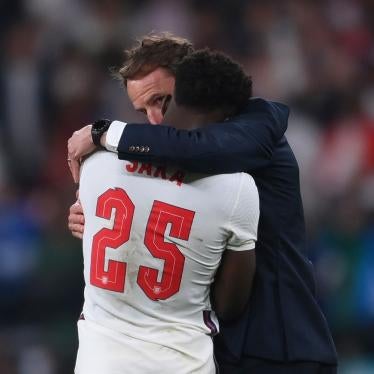 England’s Bukayo Saka (left) is consoled by England's manager Gareth Southgate (right) after the Euro 2020 soccer final match between England and Italy at Wembley stadium in London on July 11, 2021.