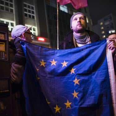 An activist holding the EU flag during a protest in Warsaw against “LGBT ideology free zones”. ©2021 Attila Husejnow / SOPA Images/Sipa USA