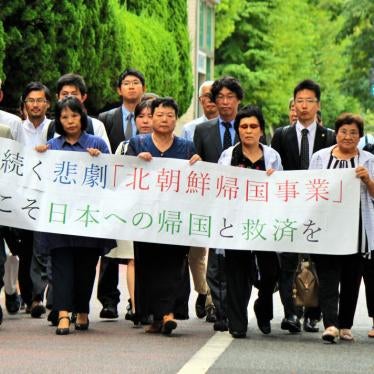Escapees from North Korea and their supporters march to the Tokyo District Court to file a lawsuit against the North Korean government for violating their human rights, August 20, 2018. 