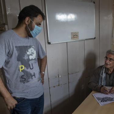 Khurram Parvez, a prominent human rights activist, left, in the office of the Jammu and Kashmir Coalition of Civil Society in Srinagar, India, August 25, 2020. 