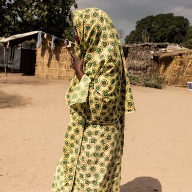 A woman walks through the Internally Displaced Person camp “25 de junho,” in Metuge, Cabo Delgado, Mozambique on May 20, 2021