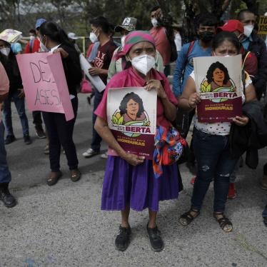 Supporters of Honduran environmental and Indigenous rights activist, Berta Cáceres, hold signs with her name and likeness during the trial of Roberto David Castillo, who was charged with her murder, outside of the Supreme Court building in Tegucigalpa, Honduras, on April 6, 2021. The trial began five years after the prize-winning activist's murder.