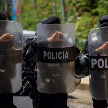 Riot police stand guard outside the house of Cristiana Chamorro, former director of the Violeta Barrios de Chamorro Foundation and opposition presidential candidate, in Managua on June 2, 2021, the day Nicaraguan police raided her home without a warrant and placed her under house arrest.