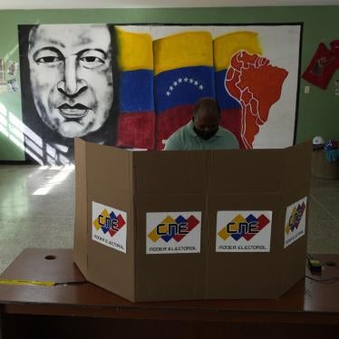 A man casts his vote during regional elections, at a polling station in Caracas, Venezuela, on November 21, 2021.