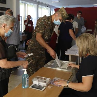 Armenians cast their ballots at a polling station on June 20, 2021 for parliamentary elections in Yerevan, Armenia.