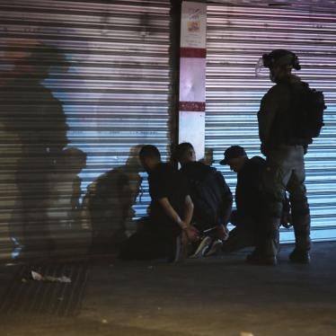 Israeli forces detain three Palestinians on May 13, 2021 during unrest in Lod, a mixed Jewish and Palestinian city in central Israel.