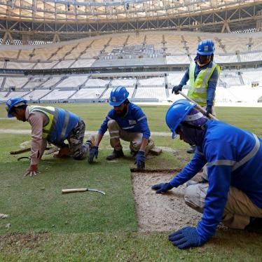  Workers lay the turf inside the Lusail Stadium, the venue for the 2022 Qatar World Cup final, in Lusail, Qatar, November 18, 2021.