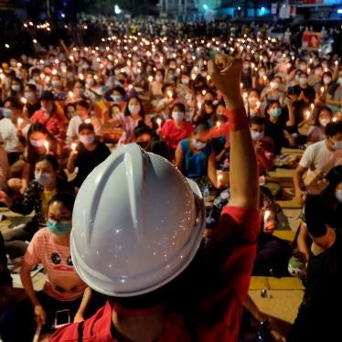 Anti-coup protesters gather during a candlelight night rally in Yangon, March 14, 2021.
