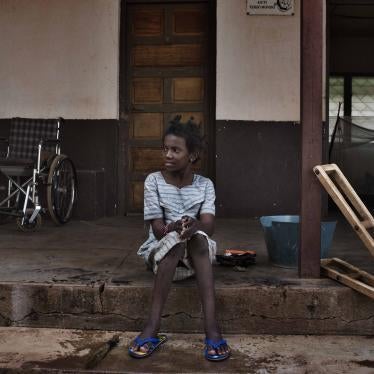 Hamamatou, a 13-year-old girl who had polio, in front of a Catholic mission where she lived in 2015.