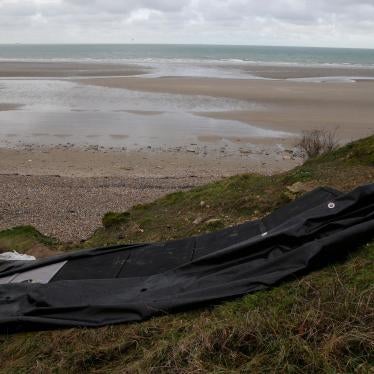 A damaged inflatable small boat is pictured on the shore in Calais, northern France, November 25, 2021.