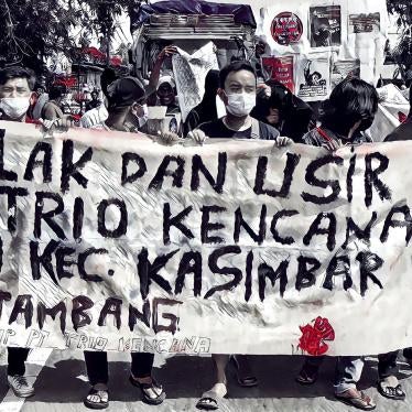 Residents in Kasimbar, who are members of the Alliance of People's Farmers, demonstrating against a gold-mining operation of PT Trio Kencana in Parigi Moutong Regency, Central Sulawesi on February 12, 2022.