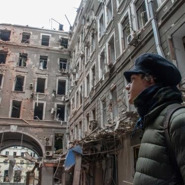 A local resident looks at his house destroyed in a Russian air raid in Kharkiv, Ukraine, March 3, 2022.