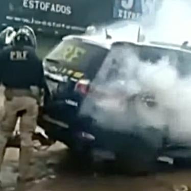 Screengrab from a video shows smoke coming out of a police vehicle