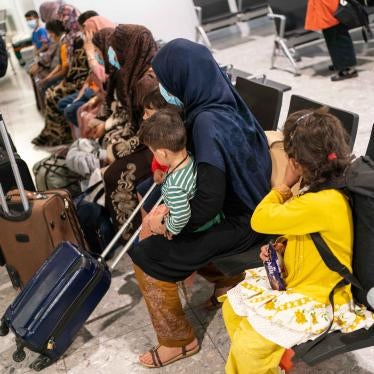 Refugees from Afghanistan wait to be processed after arriving on an evacuation flight at Heathrow Airport, London, on August 26, 2021.