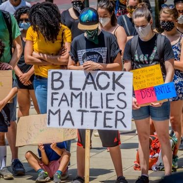 Protesters hold signs at a demonstration in Brooklyn