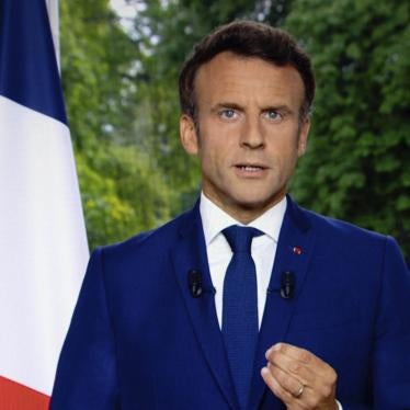 A photo of a TV screen shows French President Emmanuel Macron speaks during televised address on June 22, 2022, in Paris.