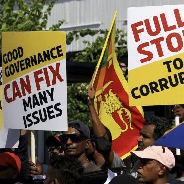 Sri Lankan anti-government protesters holding signs