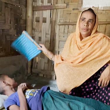 Hasina Hatu at home with her child, Cox's Bazar, Bangladesh