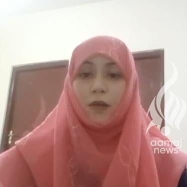 Screenshot from an online video of a woman speaking to camera