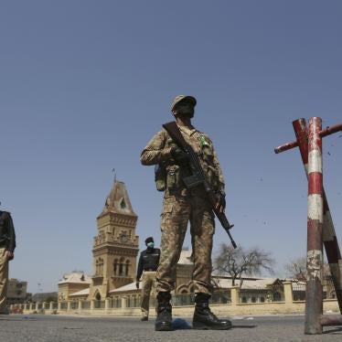 Soldiers and police stand guard during a lockdown to help stop the spread of the coronavirus, Karachi, Pakistan, March 3, 2020. 