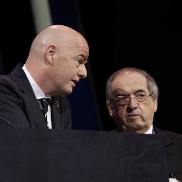 FIFA President Gianni Infantino, left, speaks with French Football Federation President Noel Le Graet
