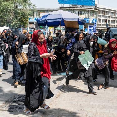 Taliban fighters fire into the air to disperse women protesters in Kabul, Afghanistan, August 13, 2022. © 2022/ AFP via Getty Images/Wakil Kohsar