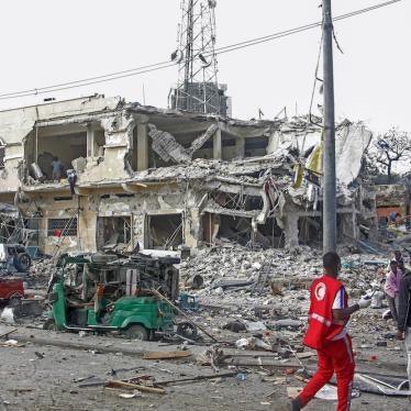 A destroyed building and vehicles after a double car bomb attack at a busy junction in Mogadishu, Somalia.