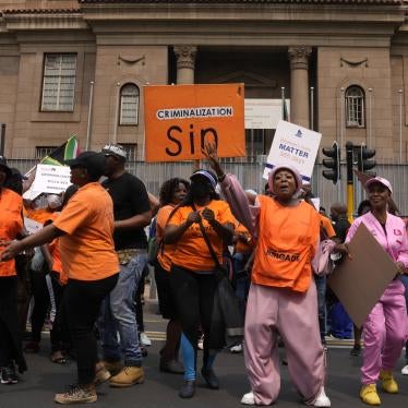 South African women's rights groups and sex workers demonstrate outside the magistrate court in Johannesburg