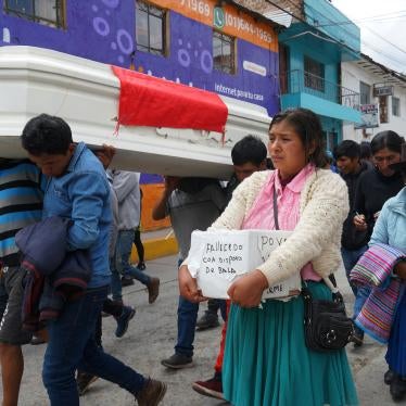 The relatives of 18-year-old Wilfredo Lizarme walk around the city streets with the casket that contains his body, in Andahuaylas, Peru.