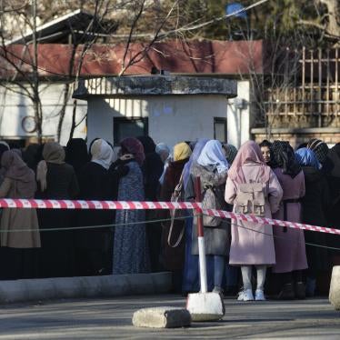 Afghan female students line up at one of Kabul University's gates