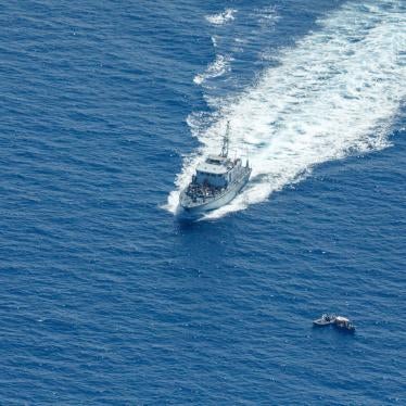 Libyan Coast Guard patrol boat Ras Jadir intercepts a wooden boat in the Mediterranean Sea, July 30, 2021. 