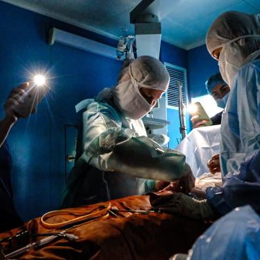 Doctors operate with phone flashlights during a power outage in Kyiv. Numerous missile and drone attacks in October and November have deprived millions of Ukrainians of at least temporary access to electricity, water, heat, and related vital services. Kyiv, November 30, 2022.  
