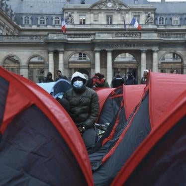 More than 200 young refugees demonstrate in front of the State Council building in Paris, December 2, 2022.  Many have been sleeping, some for 6 months or longer, under the bridges in Ivry-sur-Seine, on the outskirts of Paris.