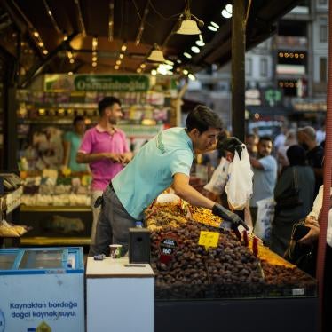 A clerk talks to a customer at the Egyptian spices market in Istanbul.